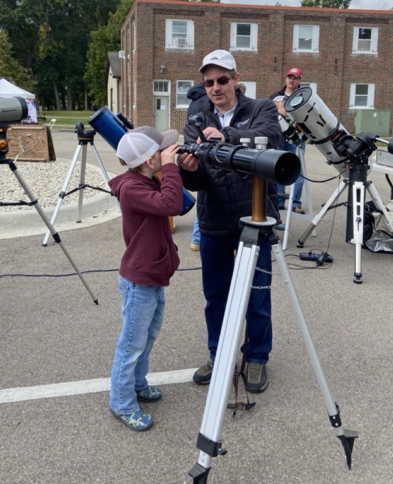 child-looking-through-telescope